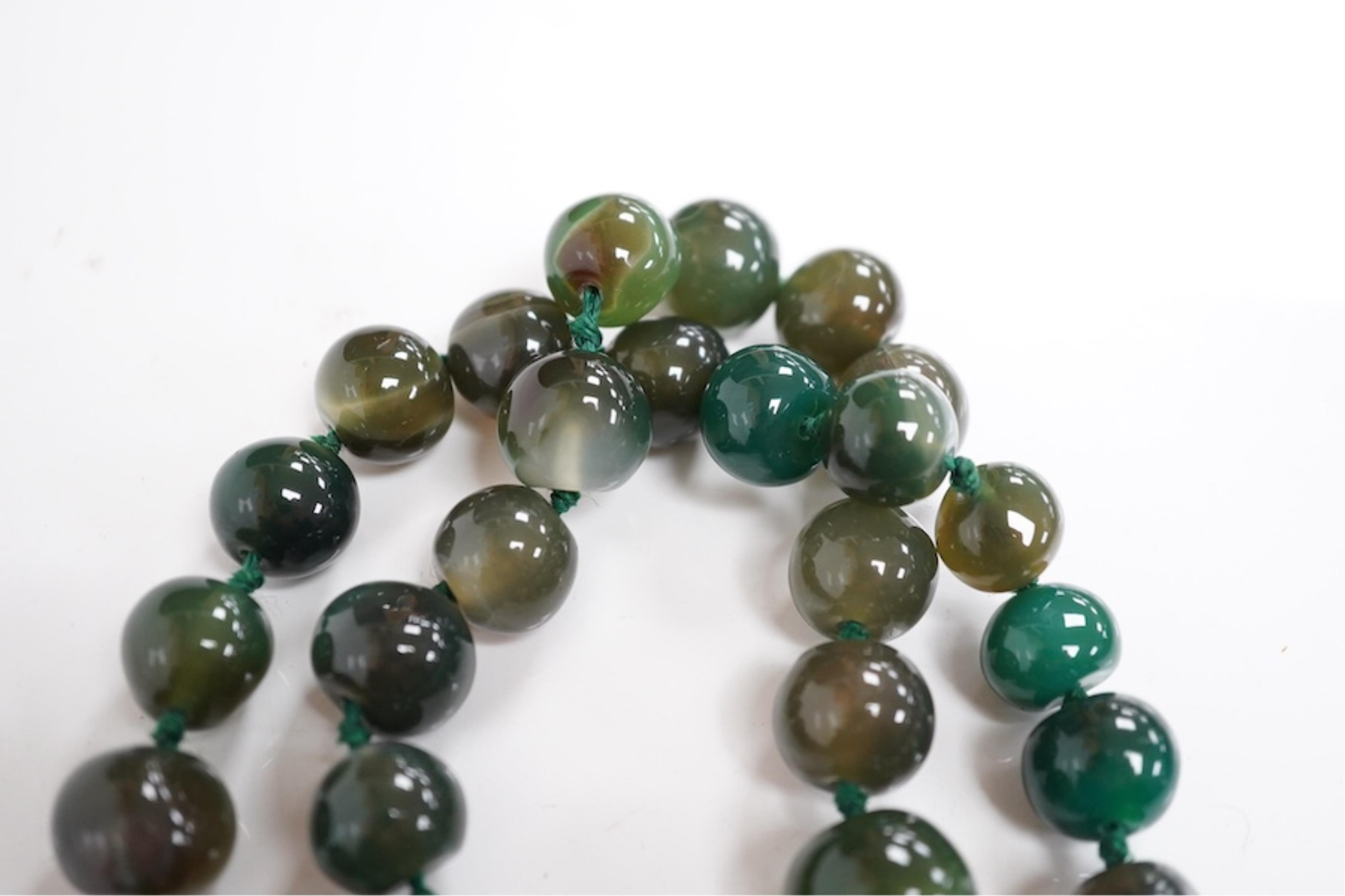 An early 20th century hardstone beaded necklace. Condition - fair